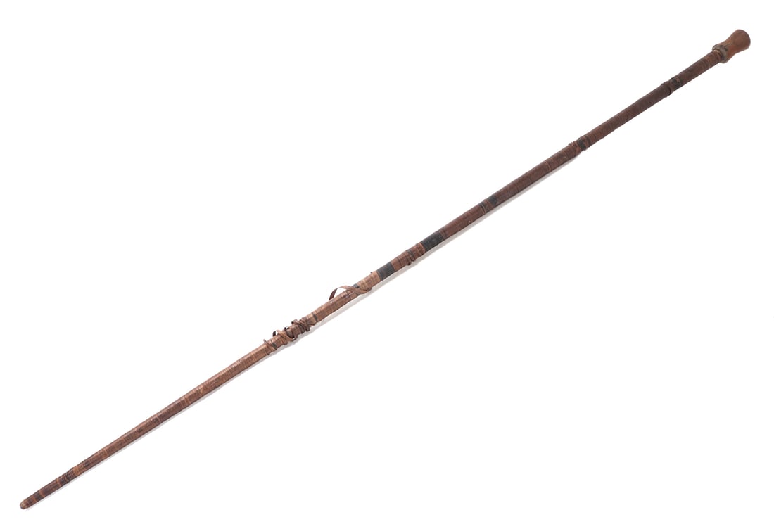19th C. Massive Blow Dart Gun, 89": Enormous Southeast Asian or Malaysian blow dark gun standing at nearly 90" overall length. 19th century. Hollowed core in wood with a large flared at either end wood opening. The entirety of the shaft