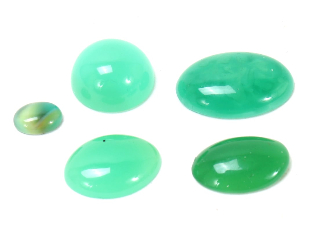 Group of Five Jade Style Stones: Fine group of five jade style stones in varying shapes and colors throughout including the smallest being a rainbow green color, two light aqua-green and one dark green. Size 3/4" L, Weight 1 gram tot