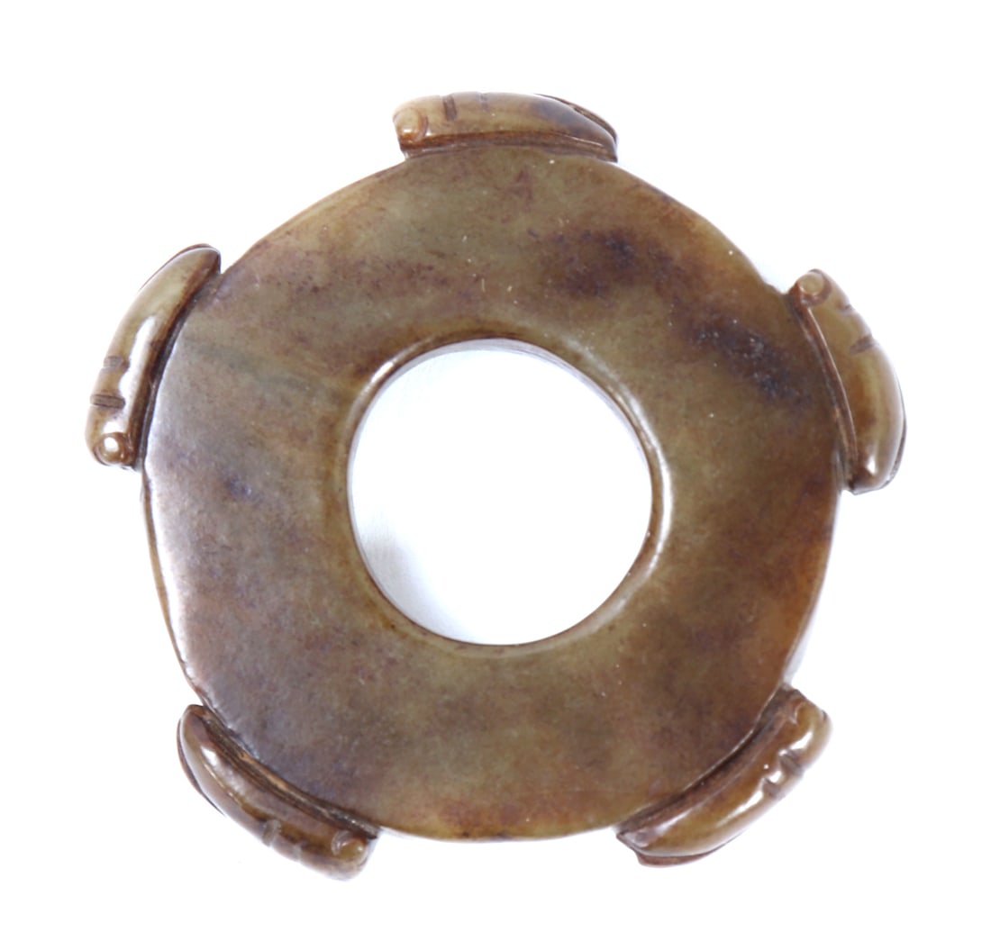 Chinese Jade Style Locust Bi-Disc: Beautiful Chinese jade style bi-disc adorned with five locusts carved in high relief to the exterior of the disc. Mottled green and brown jade style stone, drilled to the center for suspension. Size 2