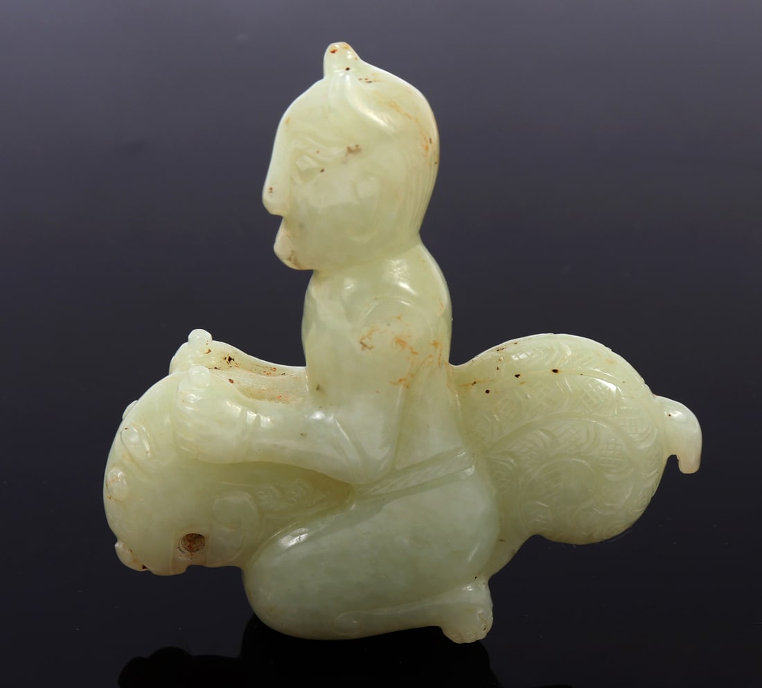Certified Nephrite Jade Guardian Pendant: Original Chinese nephrite jade carved pendant. Guardian is depicted riding on a zoomorphic beast holding on to the beats horns. Incised intricately detailed geometric designs throughout. Pierced throu
