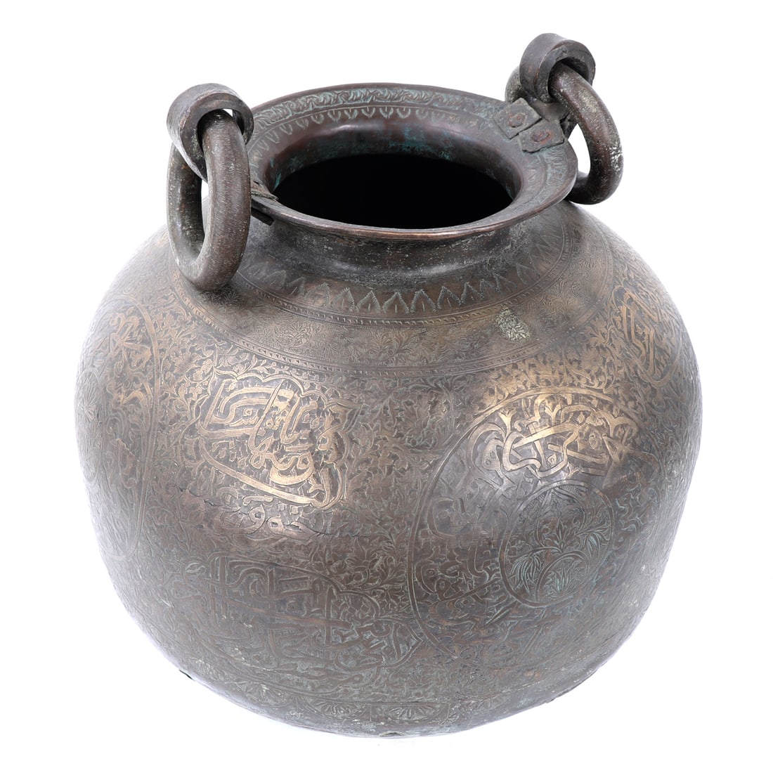 Large Islamic Bronze Water Pot with Handles: Beautiful incised Islamic bronze water pot with handles for lowering into a well or dipping into a stream of water. Incised throughout in intricate and incredible detail. Short corseted neck leading t