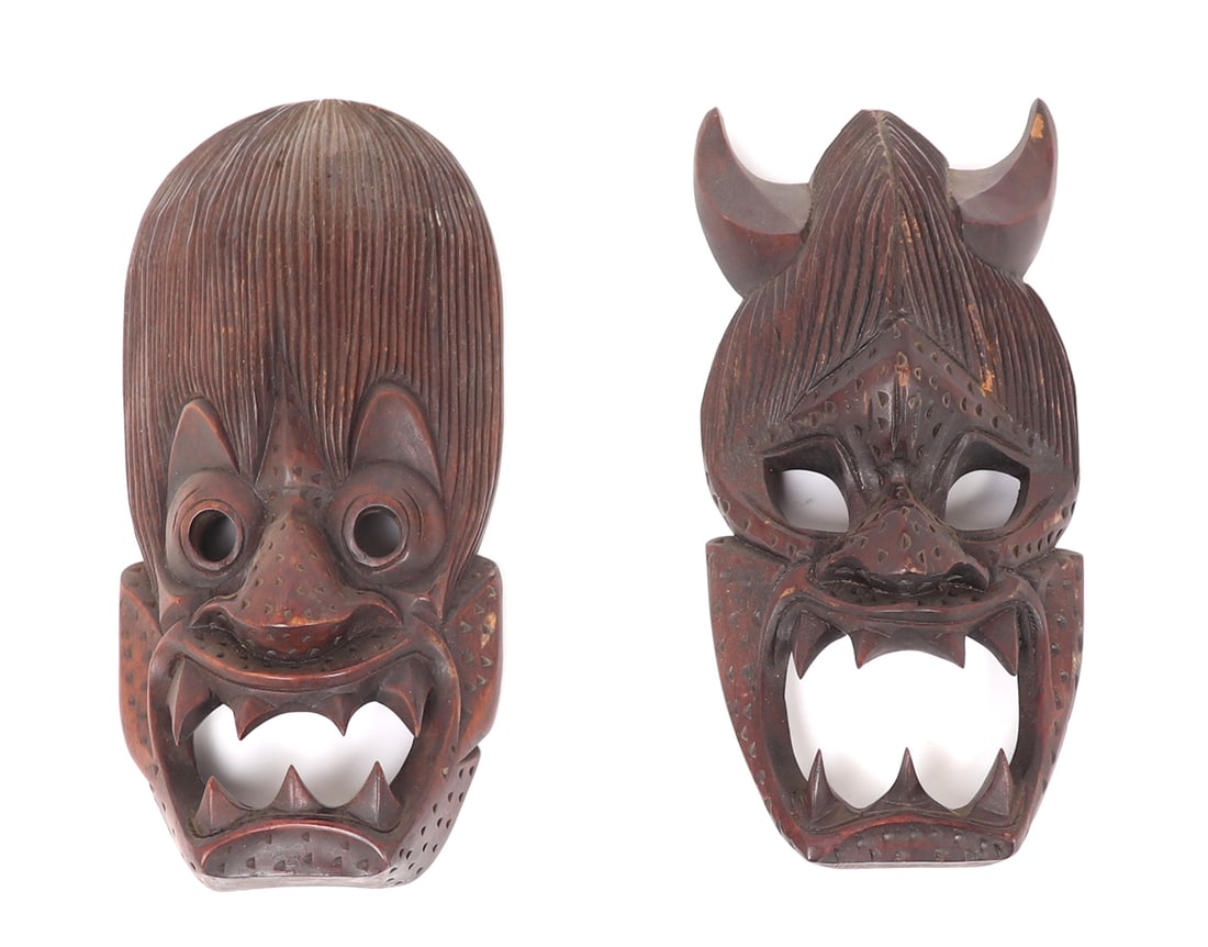 Two Wood Carved Tibetan Transformation Masks: Lovely wood carved Tibetan style masks showing mid transformation with human like hair, large beastly sharp teeth, deep hollowed eyes, and devilish horns. Each mask numbered to reverse and set for wal