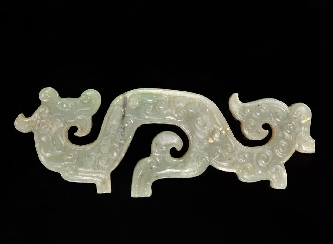 Chinese Hardstone Dragon Loong Yu Bi: Chinese hardstone carved dragon Loong Yu Bi plaque, depicting a dragon with his head looking back over his should, with high relief circular designs to the body throughout. Lovely light green hardston
