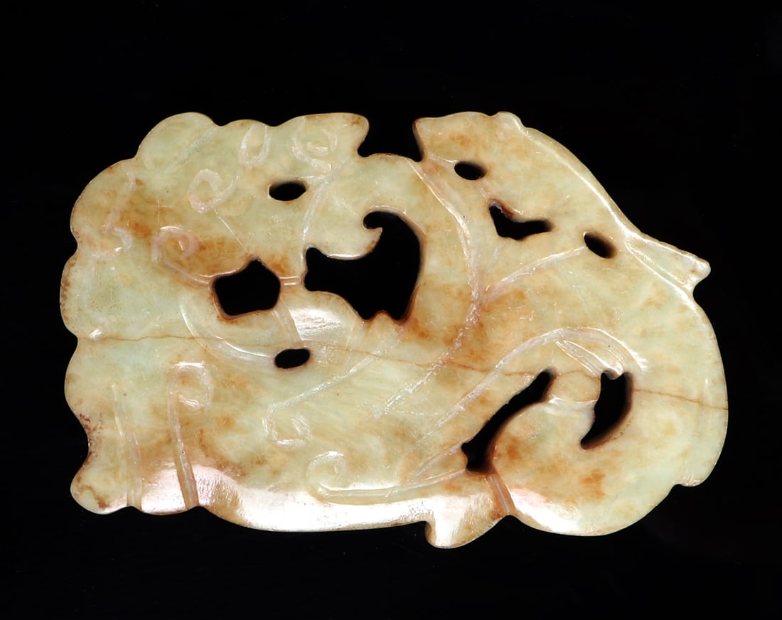 Chinese White Jade Style Dragon Pendant: Lovely Chinese white hardstone carving of a dragon with openwork throughout, scales incised throughout the body. The dragon is poised backwards with a long tail and flames pouring from his mouth. Size