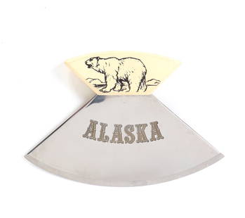 Alaskan Ulu Knife: Alaskan Ulu knife with handle decorated with a line drawing of a polar bear. "ALASKA" across the very sharp blade. This versatile tool features a curved blade which can be used for a variety of activi
