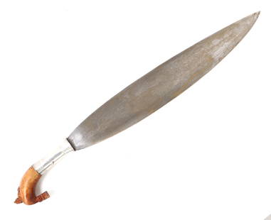 19th C. Philippines Moro Barong Sword: 19th C. Filipino Moro barung sword ornate pommel and silver handle. Single edged leaf shaped blade leading to silver shank collard and puhan. Elaborately carved wood kakatua pommel. Size 24" L, blade