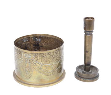 Trench Art Shell and Candlestick: Two trench art shell casing converted to a candle stick and another to a container with stippled and pressed designs to the surface. Each with numerous markings to the bases. Size candle stick 5 3/4"