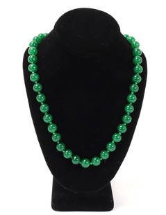 Lovely Bright Green Chinese Jade Style Necklace: Beautiful Chinese bright green beaded jade style necklace with a sterling silver style clasp. Dozens of beautiful perfect spherical beads throughout. Size of necklace 34" L, beads 1/2" W