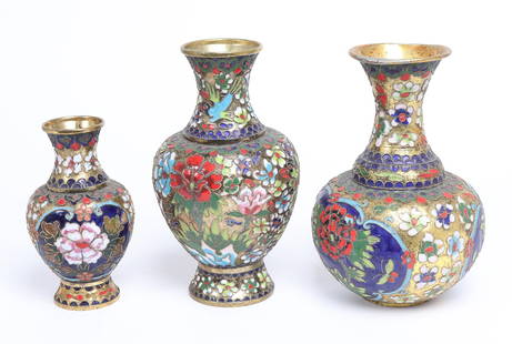 Assorted lot of Cloisonne Enamel Vase: Three Chinese cloisonne vases, in high relief rather than smooth cloisonne. Each piece includes bright cobalt, Red, pink and yellow colors against the bright brass. Size of largest 8 1/4" H
