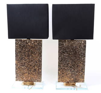 Gorgeous Pair of Bronze Table Lamps: Heavy bronze sculptural table lamps with black rectangular lamp shades. The front of the lamps are heavily decorated in bronze 'cobblestones' giving a topographical map feel. Wonderfully highlighted w