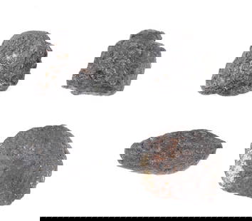 Wonderful Group of Four Meteorites: Fine collection of four ancient meteorites with a wonderful florescent patina with iron deposits throughout. Each piece exhibits distinct form and texture, ranging from angular, shrapnel-like fragment