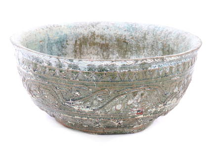 Green Glazed Han Dynasty Bowl: Fine early Han Dynasty turquoise green glazed bowl. Details in high relief throughout the entire exterior body of the bowl. gently flared rim and shallow, rounded body and a slightly raised foot. Such
