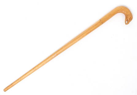American Folk Art Cane: North American folk art cane with a bird head carved handle. Carved in a light tan colored wood with a large head finial of an Eagle. Size 31" L