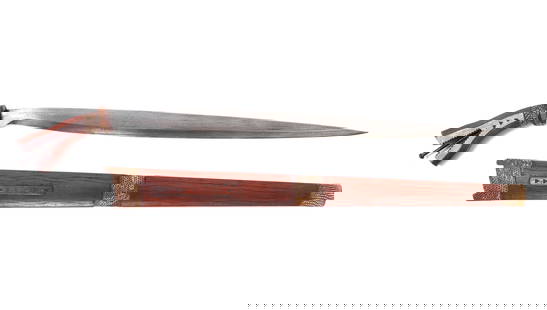 20th C. Philippines Garab/Talibon Sword: Circa 1900's Filipino Visayan Talibon sword. Straight singled edged blade with 1/8" thick spine leads to circular wood hilt. Rayskin collar above carved forked wood handle with incised designs and met
