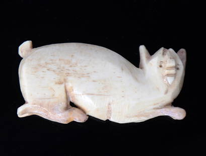 Coptic Hunting Cat Pendant, ca 5th - 6th BC: Adorable crouching feline pendant carved from bone. Depicted with perky ears, a short tail high in the air, pierced eyes, and protruding snout. Size 1 7/8" Lex-prominent NYC private collector Daryl Ku