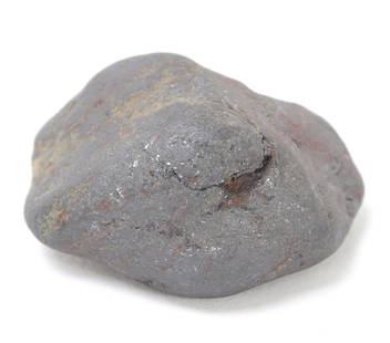 Iron-Rich Meteorite Specimen: Iron-rich meteorite exhibiting classic features of atmospheric entry and terrestrial weathering. Fine example of meteoritic morphology, showing smoothed contours and regmaglypts. Size 1 3/8" L, weight