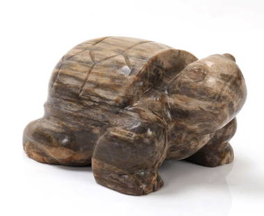Adorable Petrified Wood Turtle: Wonderful section of petrified wood carved into the shape of an adorable squat turtle with head high in the air, shell incised with classic hexagonal shapes. Marvelous coloring throughout including li
