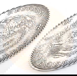 Chinese Sungarei Style Coin: Chinese 7 mace 2 candareens style coin with five clawed dragon to the face hovering above a flaming pearl to the front and seal marks and calligraphy to the reverse. Size 1 1/2" L x 1 1/2" W, weight 2