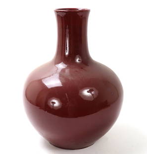 Chinese Porcelain Bulbous Body Vase: Lovely Chinese porcelain vase in a bright ox blood vase with a large body tall narrow neck and slightly flared rim and unglazed foot. Size 14" L x 14" W x 18" H