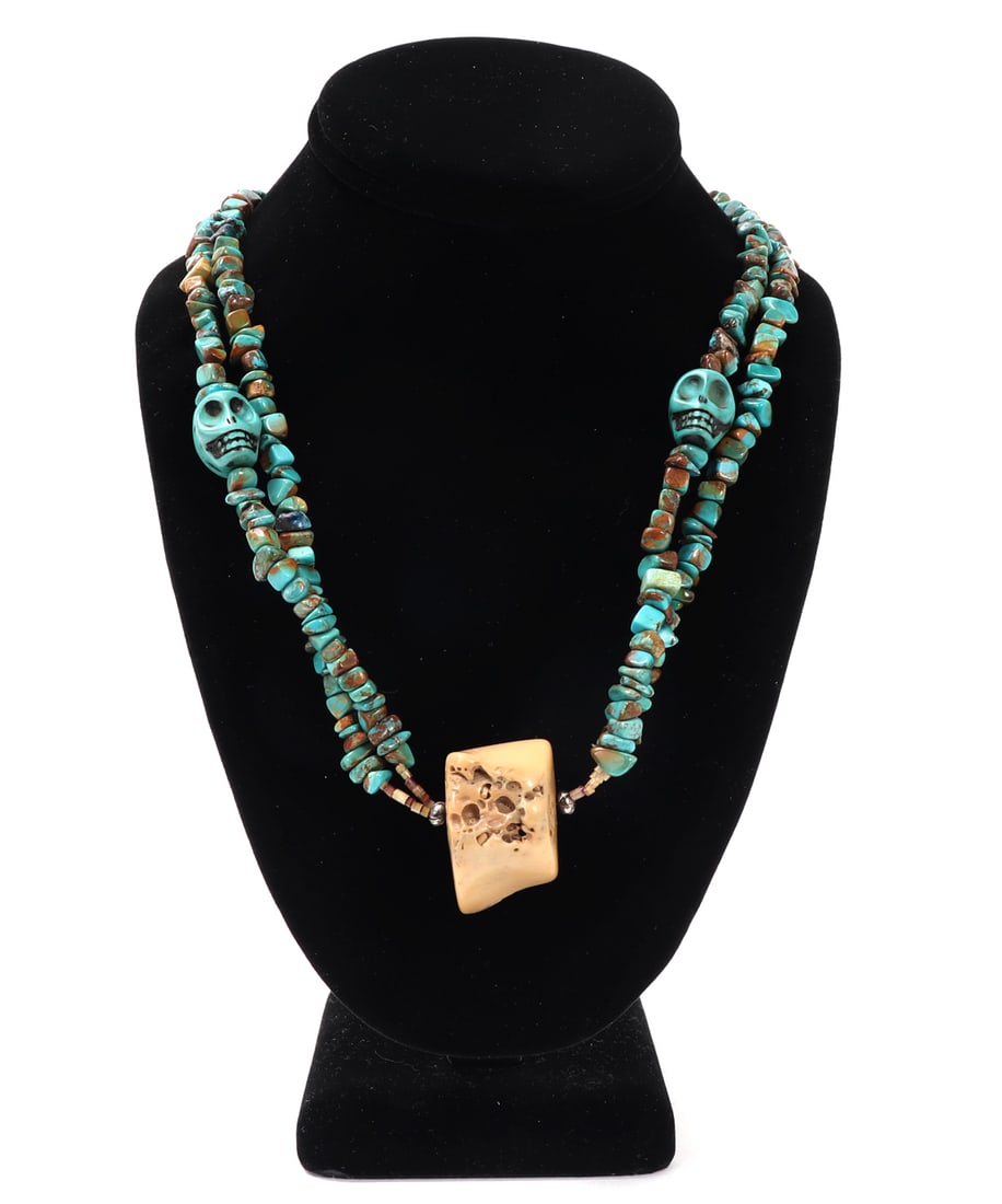 Gorgeous Turquoise, Shell, Bone and Sterling Silver Necklace: Wonderful all natural dual stranded turquoise beaded necklace, including turquoise carved skull accent beads. Bone carved and polished center pendant, shell spacer beads to the pendant and the at the 