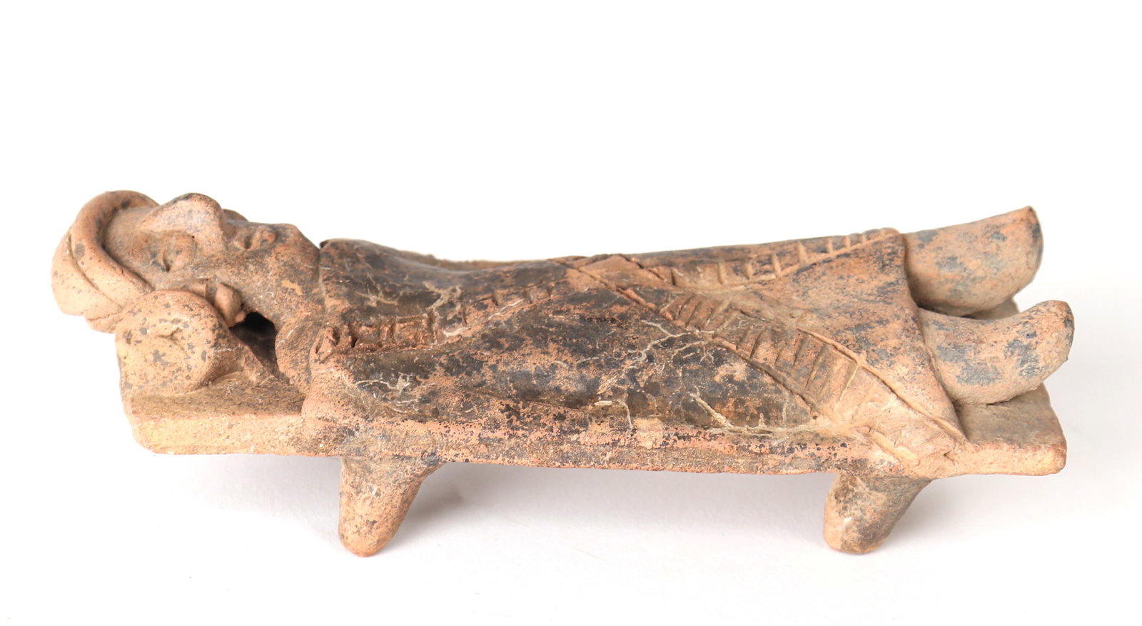 Colima Bed Figure, 100 BCE-250 CE: Pre-Columbian, West Mexico, Colima 100 BCE-250 CE clay male figure in four post bed covered in a decorated blanket. Size 6 1/8" L Ex-Cliff Baker Collection San Diego, CA (formed 1960s). ex-Private Cal