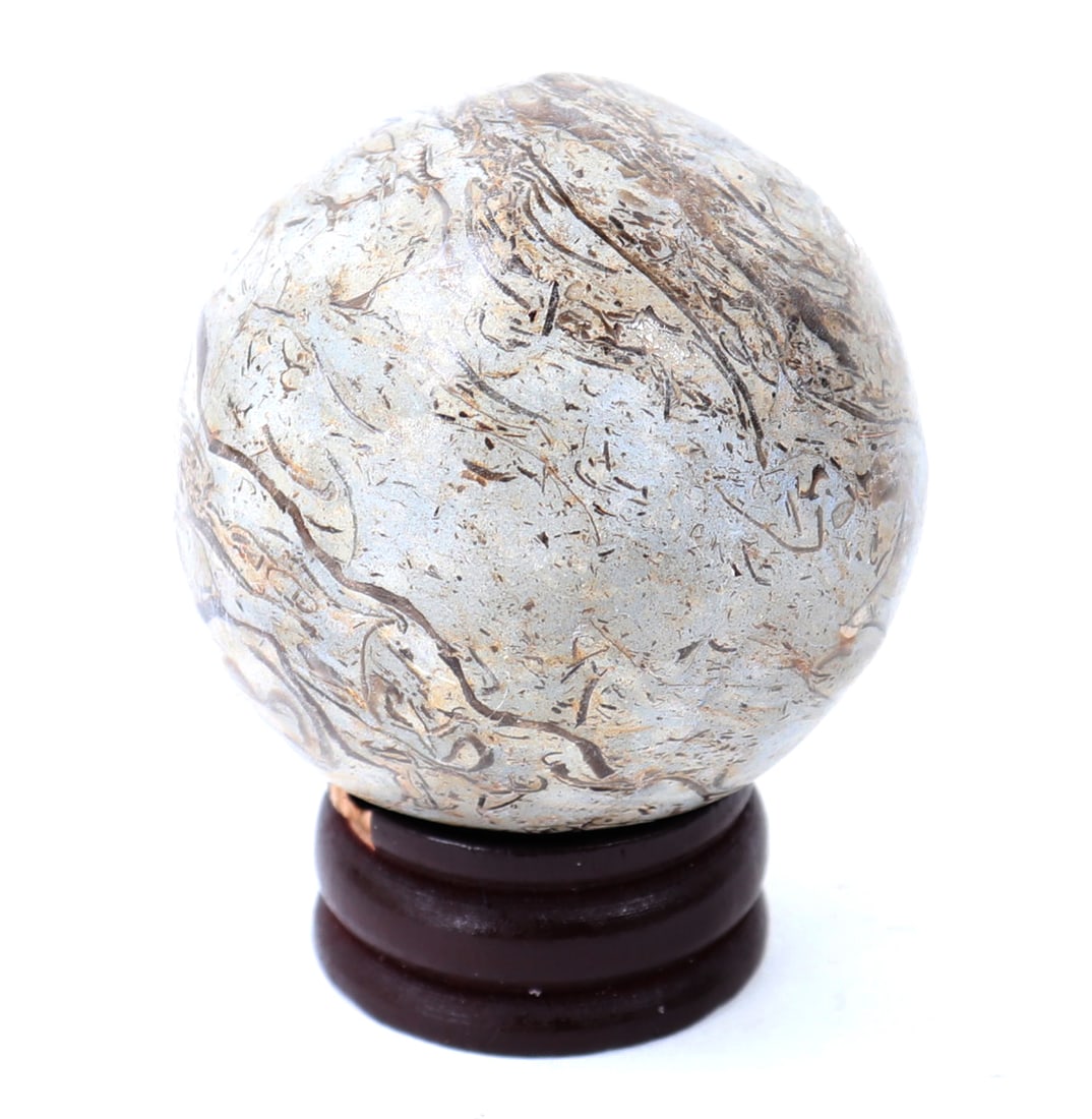 Ancient Dinosaur Bone Polished Sphere: Wonderful ancient polished dinosaur bone with wonderful inclusions throughout including light blue and cream colored veining throughout. Size 1 1/2" L x 1 1/2" W, weight 110g