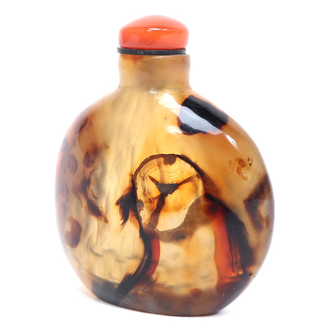 Unique Caramel Fountain Glass Snuff Bottle: Chinese stone carved snuff bottle with a waterfall of caramel, coffee, chocolate coloring throughout. Areas of the snuff bottle are opaque, coral hardstone stopper and spoon still intact. Size 2 1/2"