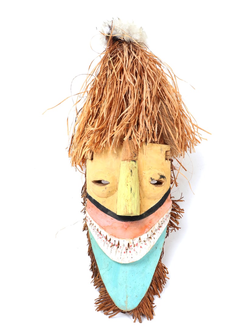 Lively Tolai Wood Carved Mask: Brightly painted East New Britain Province, New Britain Tolai wood carved mask in white, orange, yellow and turquoise pigment throughout. Long chin leading to a fiber frame, almond slip eyes and recta