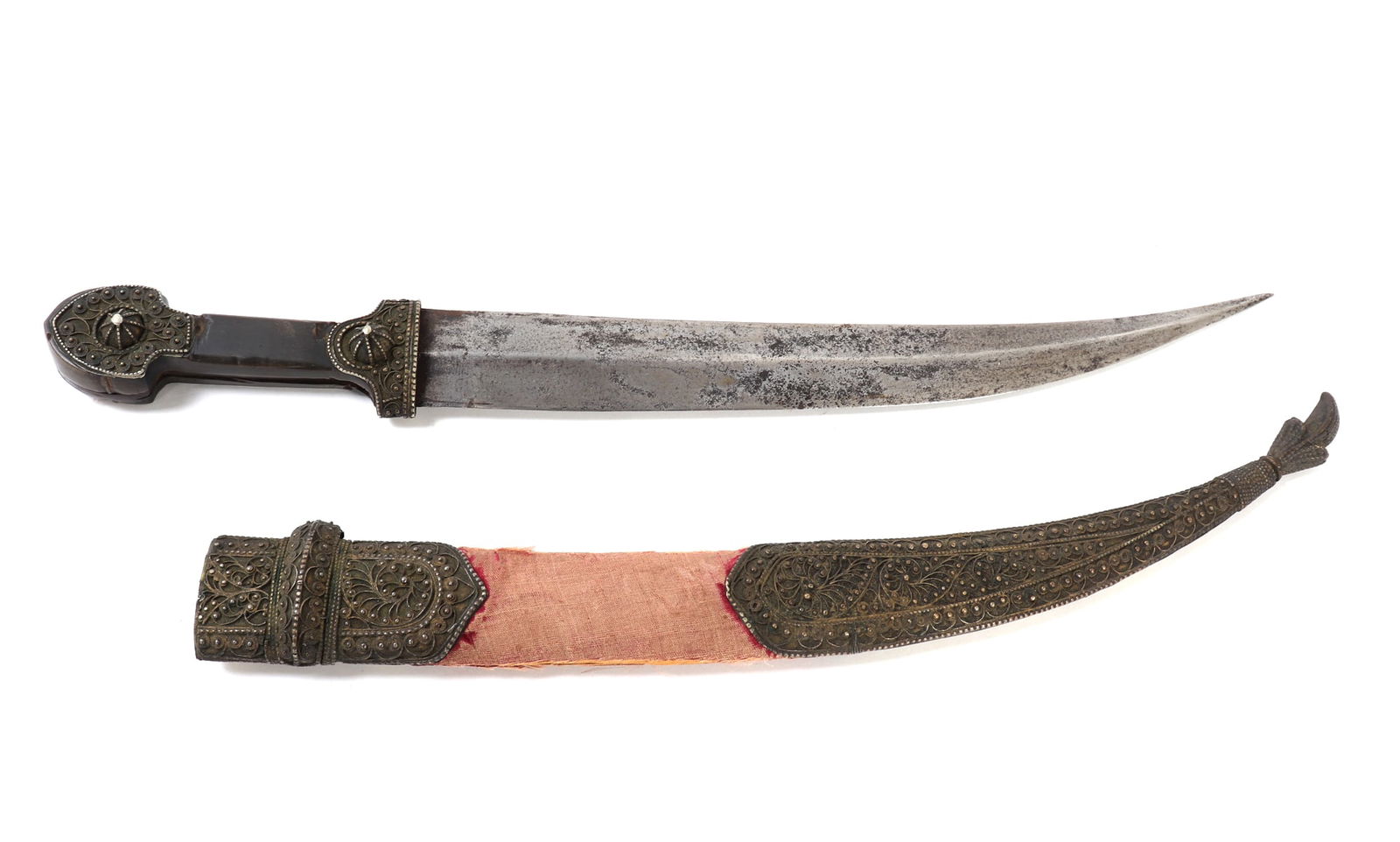 Old Kindjal Dagger with Ornate Scabbard: Nicely made Russian kindjal dagger with a well detailed scabbard. Wood handle with intricately detailed metal appliques. Scabbard with red fabric and intricate metal detailing throughout. Size 18" L,