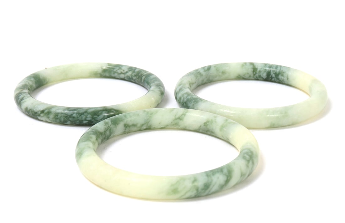 Group of Three Chinese Marbled Green Bangles: Nice group of Chinese marbled green stone bangles with wonderful green and cream coloring throughout each. Size of each 2 3/8" W, total 111 grams