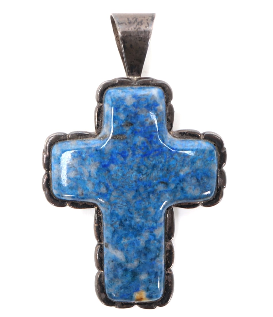 Sterling Silver & Lapis Lazuli Crucifix Pendant: Lovely polished lapis lazuli raw specimen shaped into a cross, set into a sterling silver bezel with light flower peddle framing. Marked to the reverse with a makers initials DTR, China, 925. Size 3" 