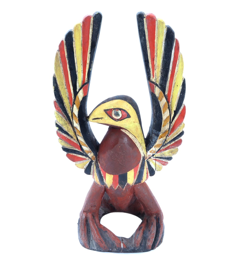 Brightly Painted Wood Carved Eagle Headdress Finial: Beautiful hand carved wood bird headdress finial, mauve red body, black, yellow and red feathers. Yellow face with stone inlayed eyes. Wonderful craftmanship throughout. Size 11 3/4" L, weight 299 g C