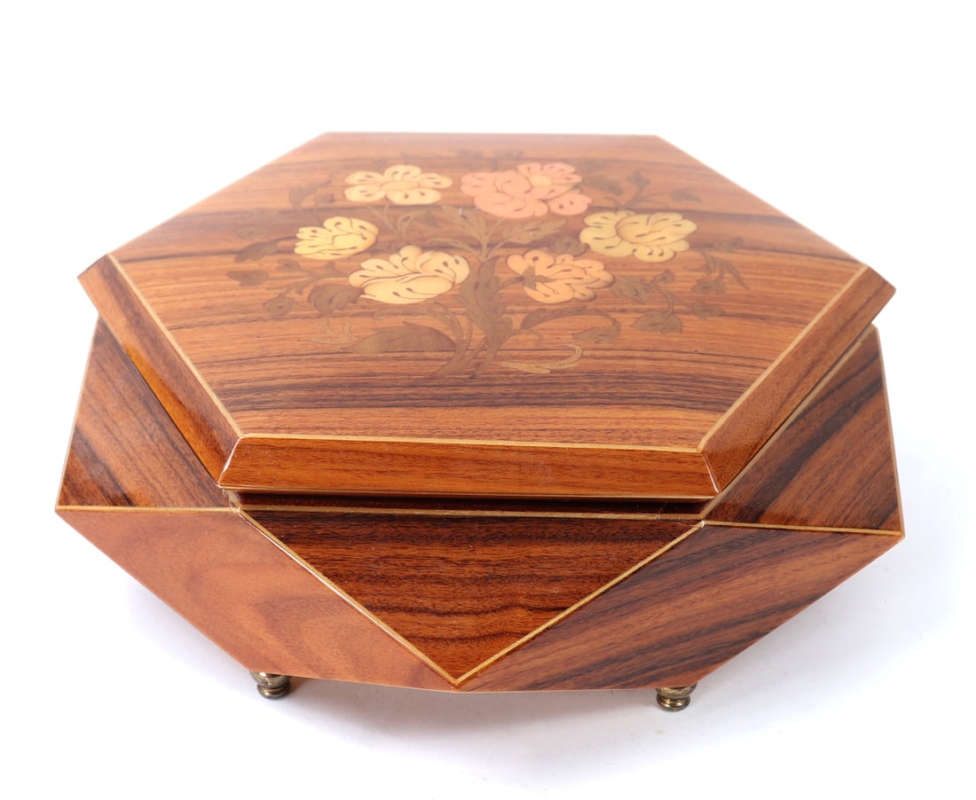 Swiss Burled Lacquered Wood Music Box: Beautiful offset double hexagon shaped jewelry box, footed and decorated in floral marquetry on a gorgeous burled lacquered wood. Lovely floral detail to the face in light pink, orange and yellow. Pla