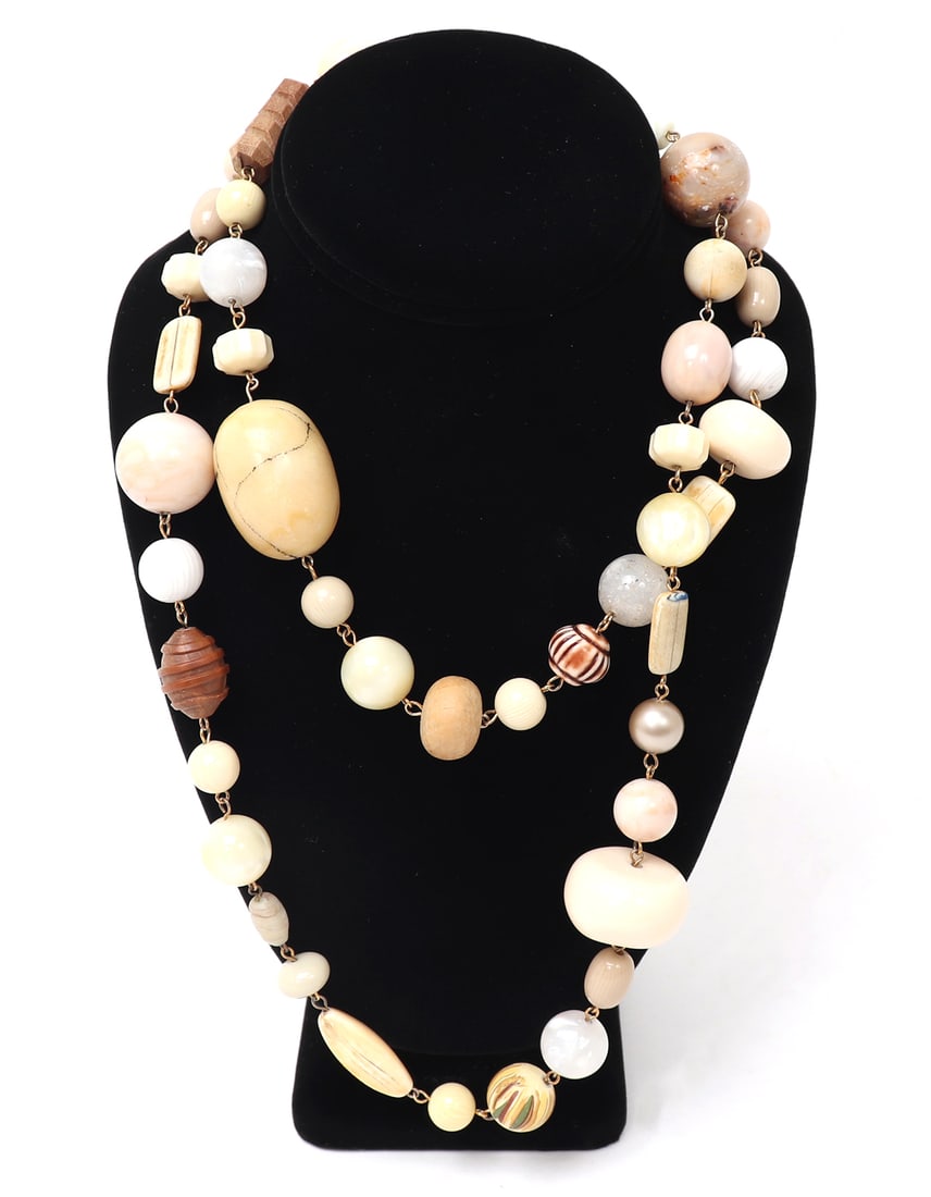 Lovely Bone & Agate Bead Layering Necklace: Beautiful layering necklace comprised of bone, agate and shell beads throughout. Measuring three and a half feet long, this piece can be layered in a number of fashionable ways. Size 42" L