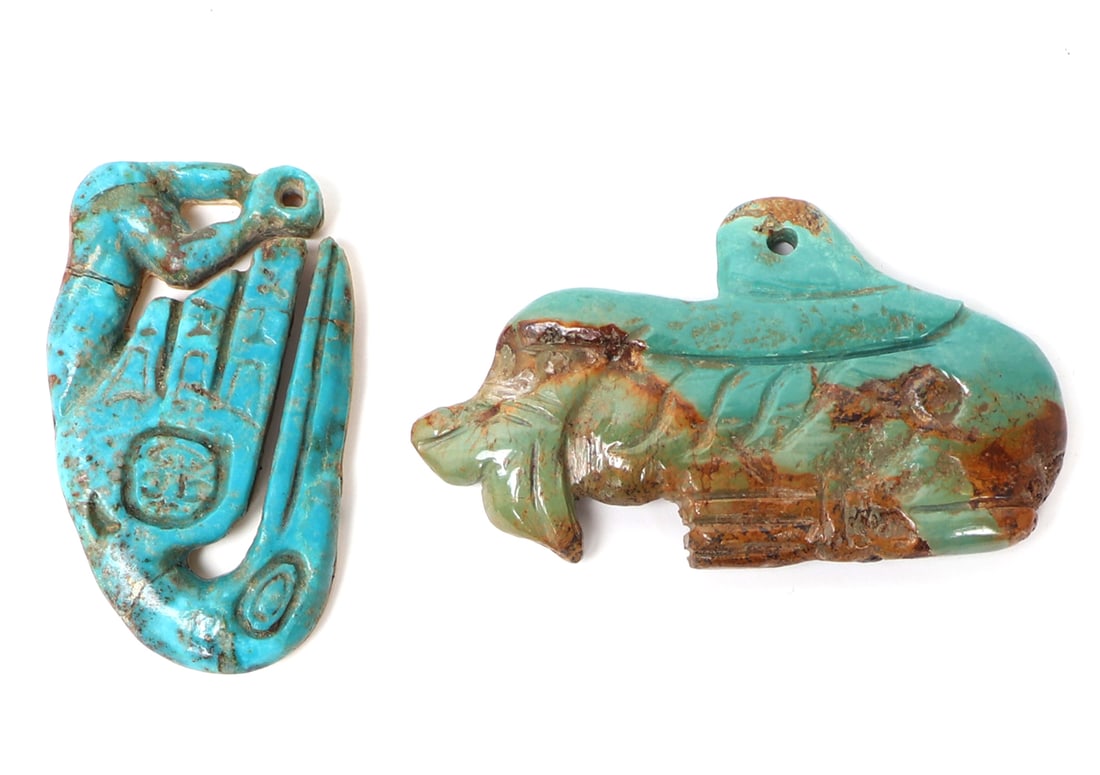Two Native American Turquoise Pendants: Two carved Native American turquoise pendants with one of a whale and another a large bird. The reverse of the bird bone backed and signed with two overlapping initials. Size of whale 3 1/4"L Ex-Arizo