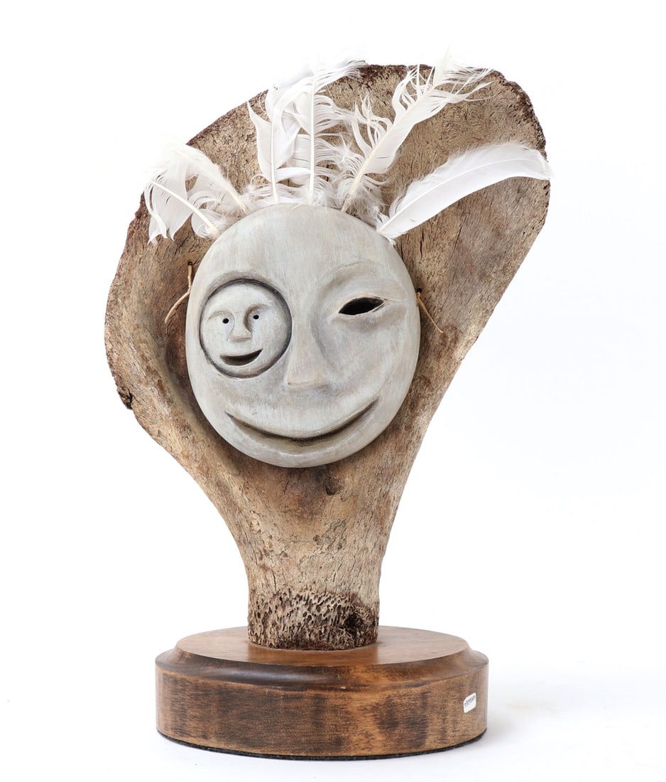 PNW Inuit Moon & Face Mask Lunar Tuunraq: Native American, Pacific Northwest Coast, Alaska. Representing the benevolent man in the moon, beautiful Inuit bone carved mask mounted on a section of bone on a beautiful wood stand. Feathers affixed
