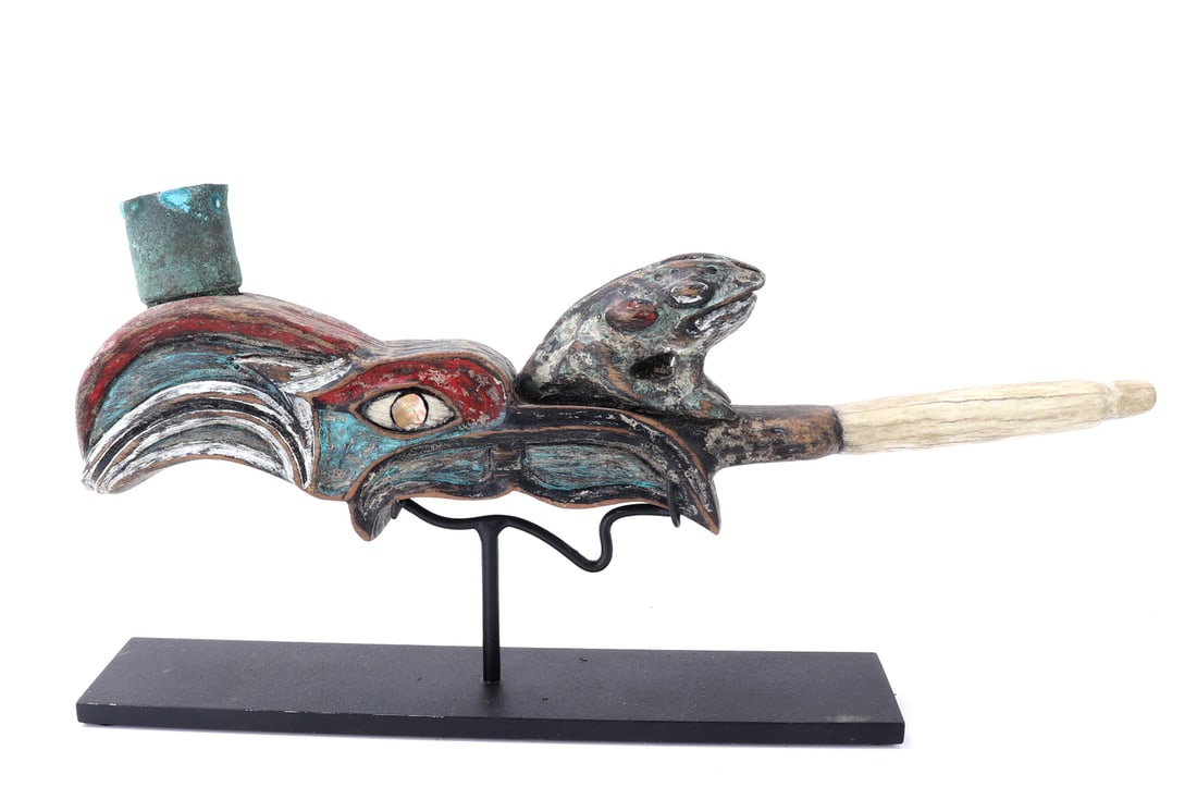 1920's Pacific NW Coast Smoking Pipe on Stand: Port Hardy, British Columbia 1920's smoking pipe. Comprised of wood, antler and bone with the body in the shape of a bird with a large beak, mother of pearl inlayed eyes, and a frog facing the opposit