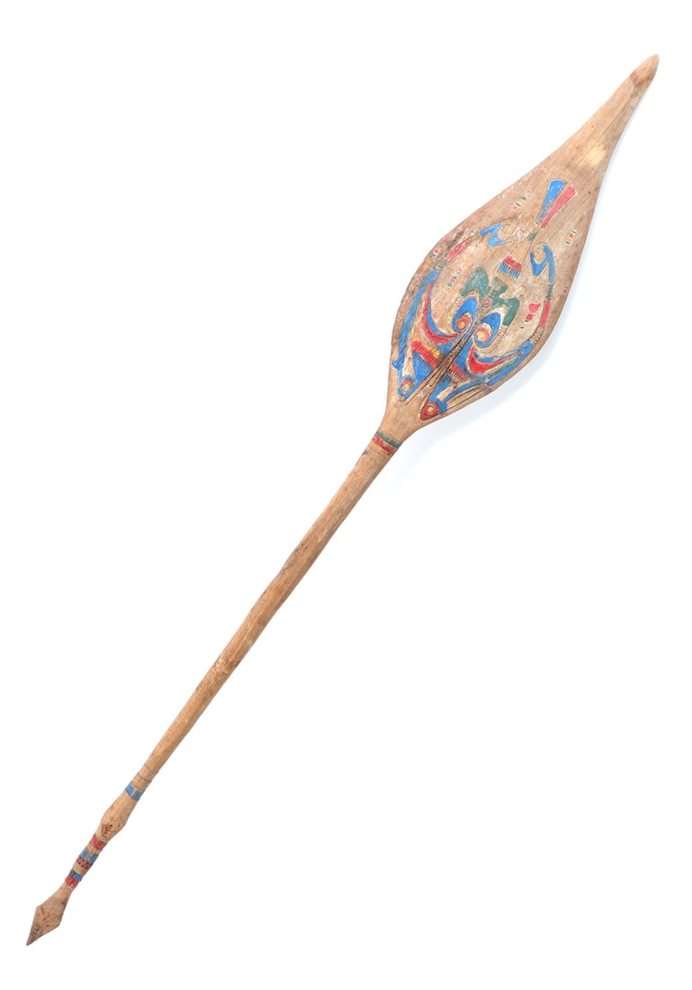 Incised and Painted Sissano Lagoon Paddle: Beautiful hand carved wood paddle, intricately incised throughout with lovely bright pigments throughout including yellow, blue, green and red. Size 61 1/8" HCollected prior to 2008, ex-Lacy Gallery (
