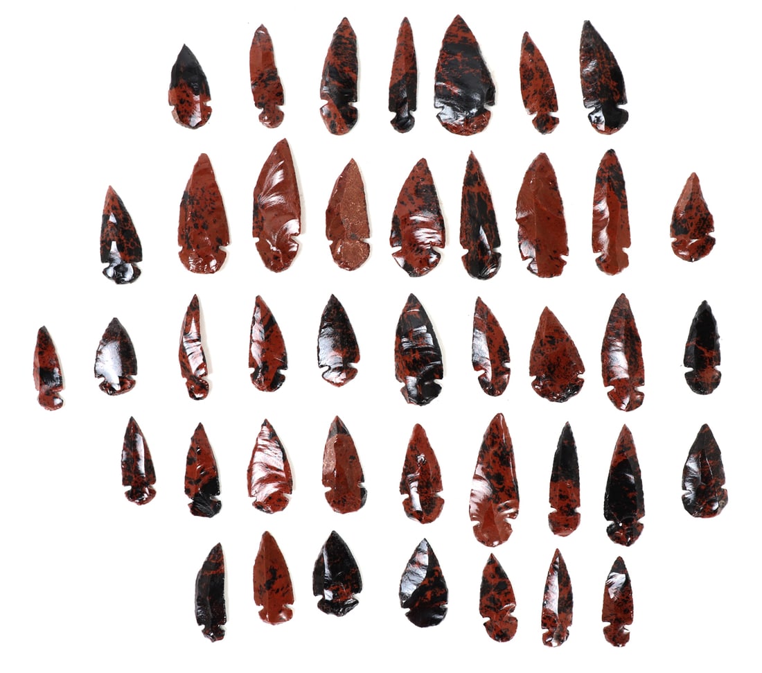 Large Collection of 24 Red Jasper Arrowheads: Wonderful collection of various sized and shaped red jasper arrowheads. Each with classic red and black coloring throughout. Size 2 5/8" L, weight 10 g.