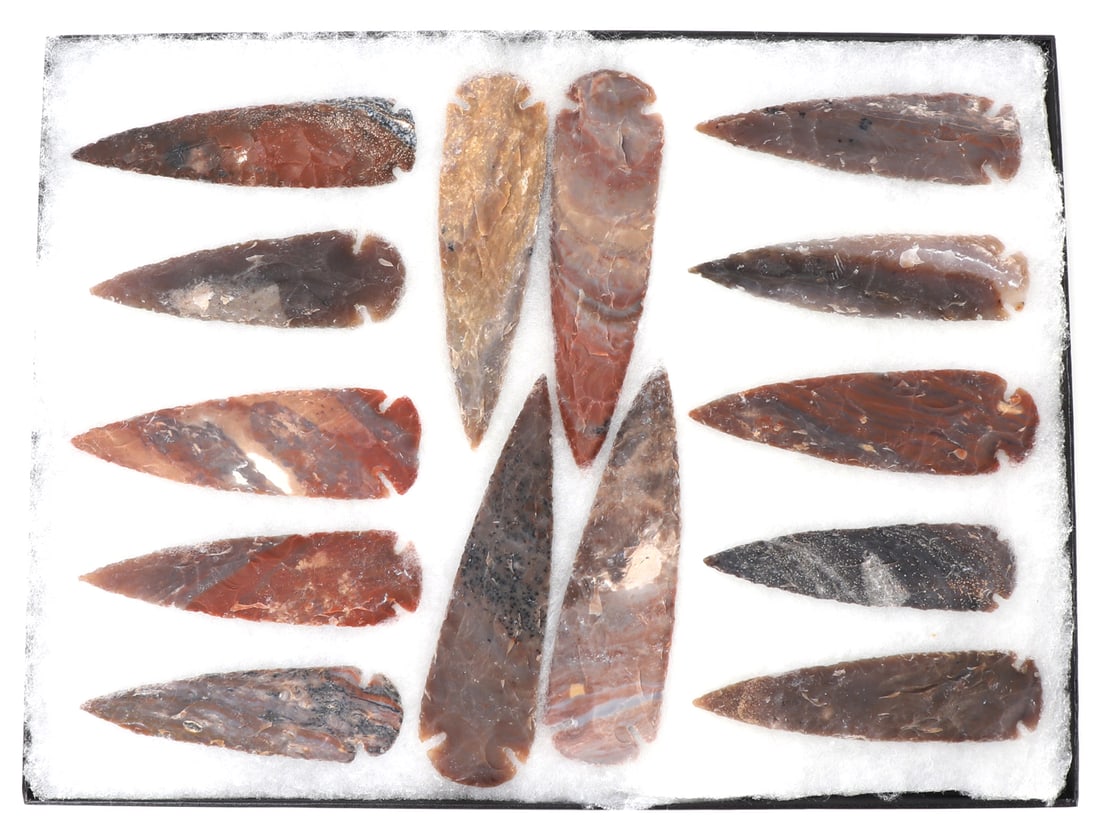 Fourteen Wonderful Native American Arrowheads & Spearheads: Very nice collection of 14 Native American hand made arrowheads and spearheads, each in a various stone composition including some marbled red jasper and others. Size of longest 6 1/2" L