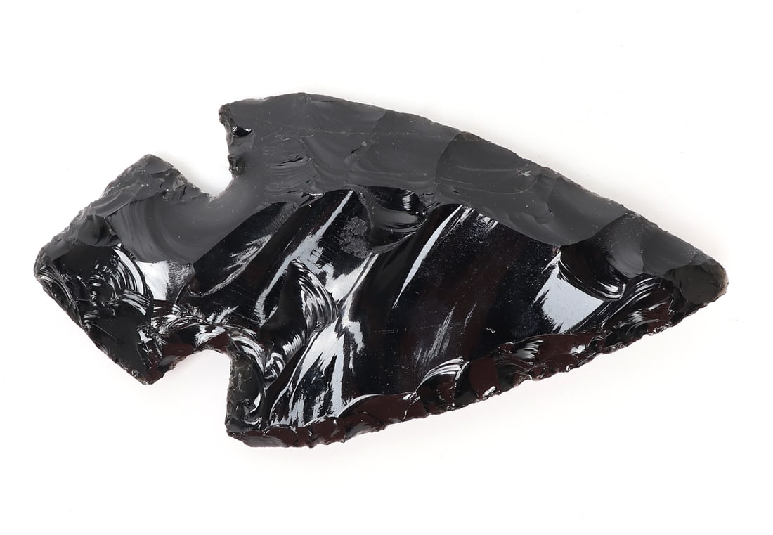 Large Fine Obsidian Spearhead: Finely knapped obsidian spearhead or arrowhead, due to the size it would make a more practical spearhead. Carefully knapped edges leading to a point. Size 6 1/2" L x 3 1/2" Wprivate property Northern