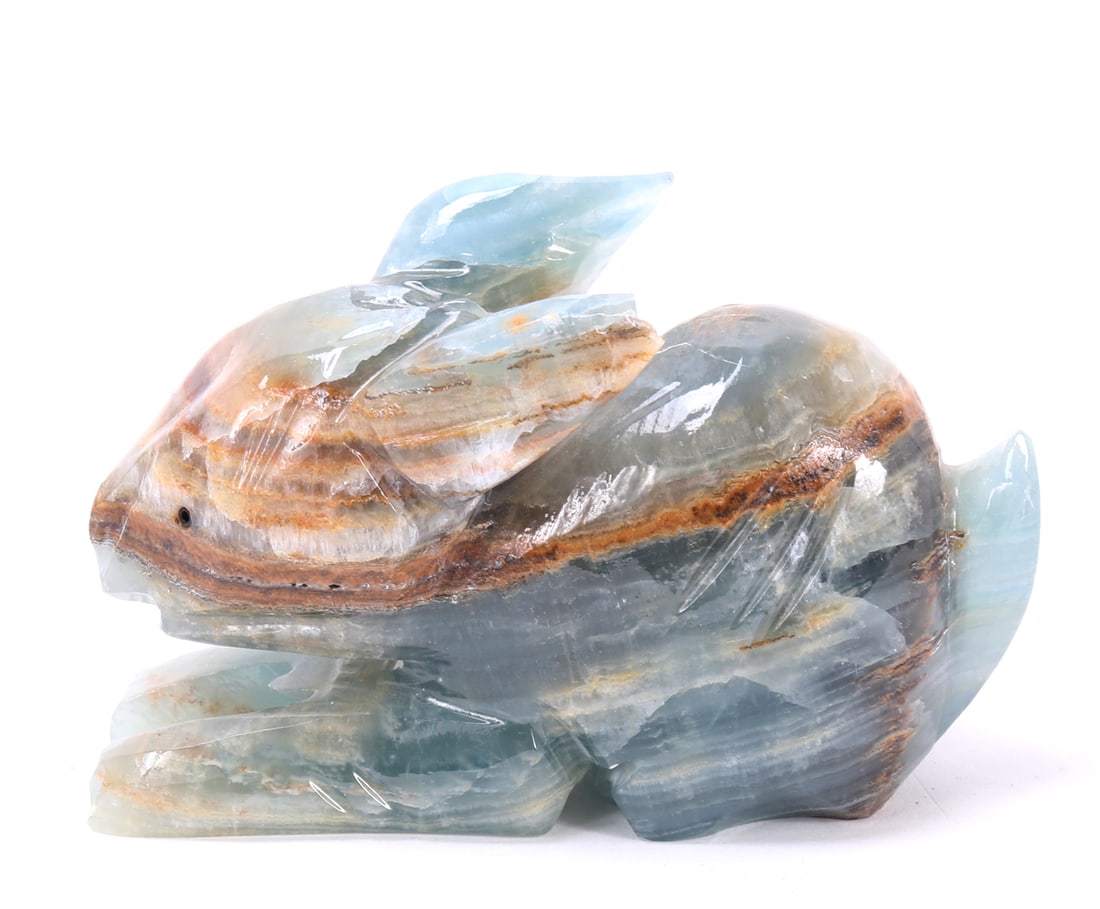 Adorable Miniature Aquamarine Carved Bunny: Sweet carved natural aquamarine mineral specimen in the shape of a recumbent bunny rabbit. Light blue and lovely earthen banded tones throughout. Ears pointed backwards with tail pointed in the air. S