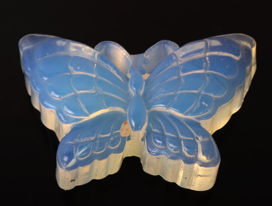 Finely Carved Opal Butterfly: Wonderfully detailed opal mineral specimen polished smooth with incredible iridescence throughout. Size 2" L x 1" W x 1/2" H, weight 1.25oz