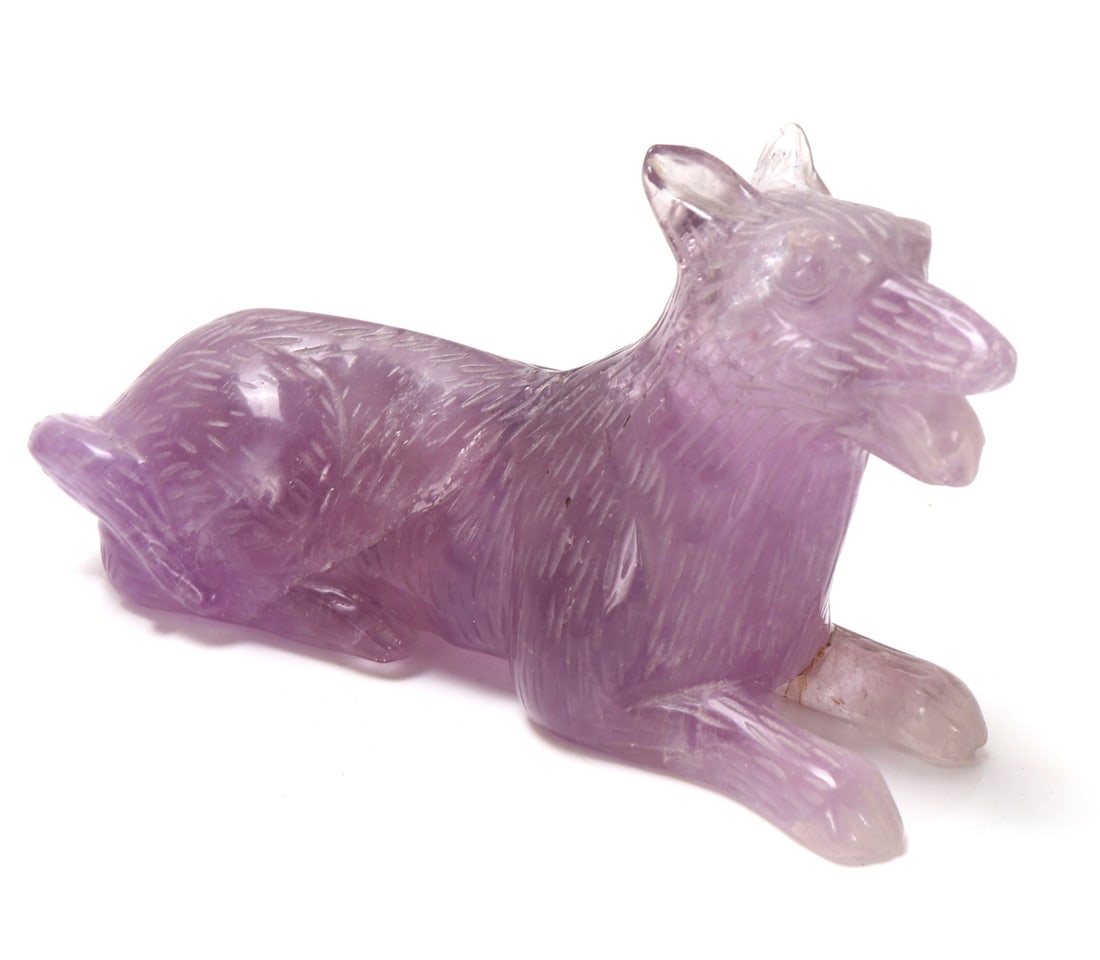 Amethyst Crystal Carved Recumbent Wolf: Beautiful all natural amethyst crystal mineral specimen brilliantly carved into a recumbent wolf. Front legs outstretched in front, mouth open with tongue hanging out as though the dog was hot or just