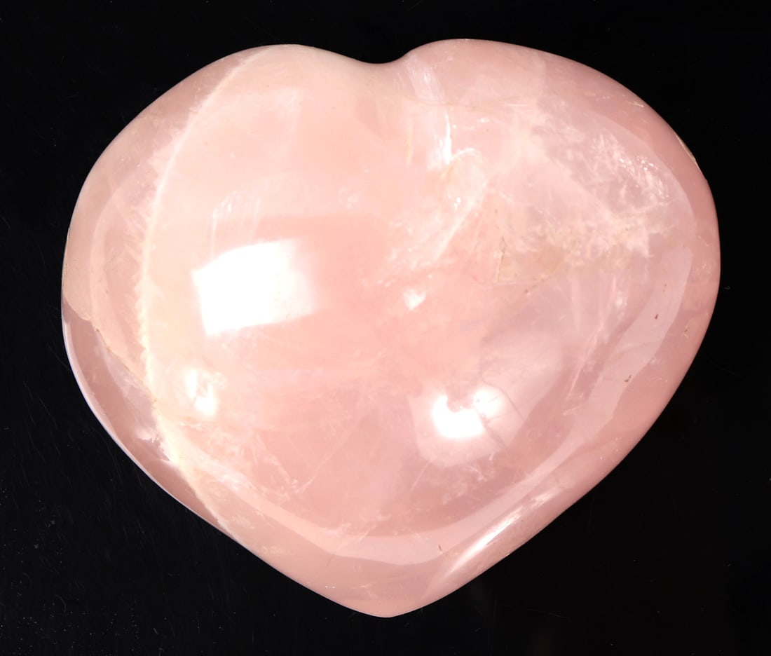 Beautiful Raw Pink Rock Crystal Quartz Heart: Beautiful natural raw pink rock crystal mineral specimen in the shape of a perfectly polished heart. Beautiful natural crystal inclusions throughout, natural translucency when held to natural light th