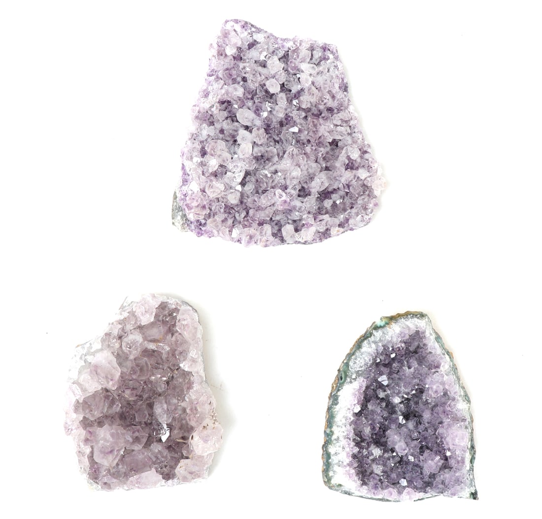 Three Lovely Amethyst Geode Sections: Three beautiful sections of crystal amethyst rock geodes in varying colors of purple including dark purple, light purple and lavender. Size 3 1/2" L, Weight 237 g