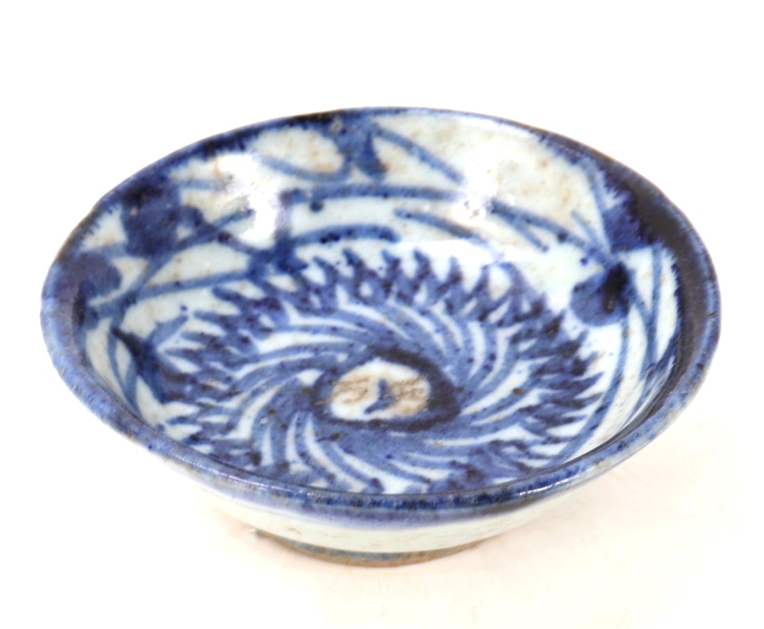 Korean Blue & White Ceramic Wine Cup: Beautiful white glazed and cobalt blue painted Korean ceramic wine cup. Center features a beautiful chrysanthemum in bloom with vine designs all around the interior rim. Raised pedestal foot with ungl
