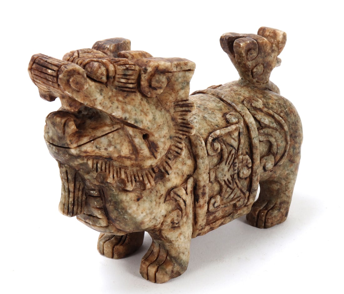 Chinese Soapstone Carved Foo Dog Figure: Nice Chinese soapstone carved foo dog or foo lion figure. Beautiful marbled green and brown soapstone with intricately carved details throughout. Foo dog is depicted standing tall and proud, tail