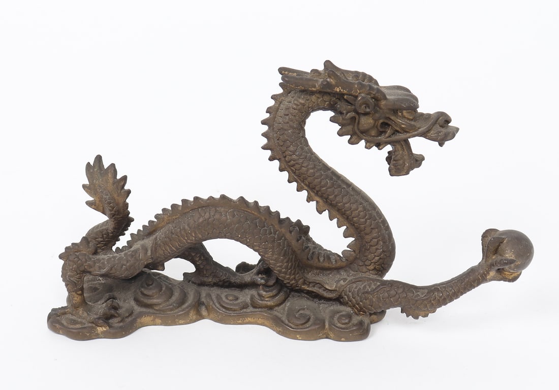 Chinese Bronze Dragon, Catching Flaming Pearl: Finely detailed Chinese bronze dragon with a flaming pearl in the his firm grasp. Mouth agape and poised for what's next, this figure is a great addition to any mantel or desktop. Size 7" L x 3 1/4" H