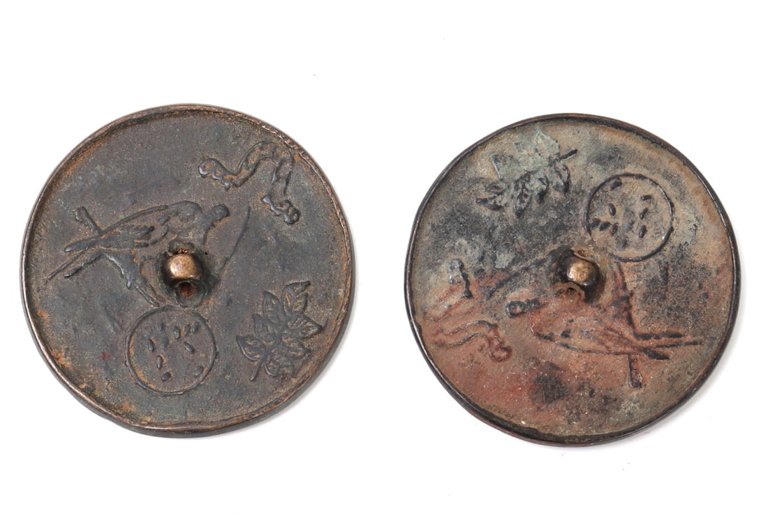 Nice Pair of Chinese Bronze Mirrors, Birds: Two Chinese bronze cast mirrors each depicting birds perched on branches with seal marks and raised loop for holding and carrying. Size 1 1/2" L x 1 1/2" W x 1/4" H
